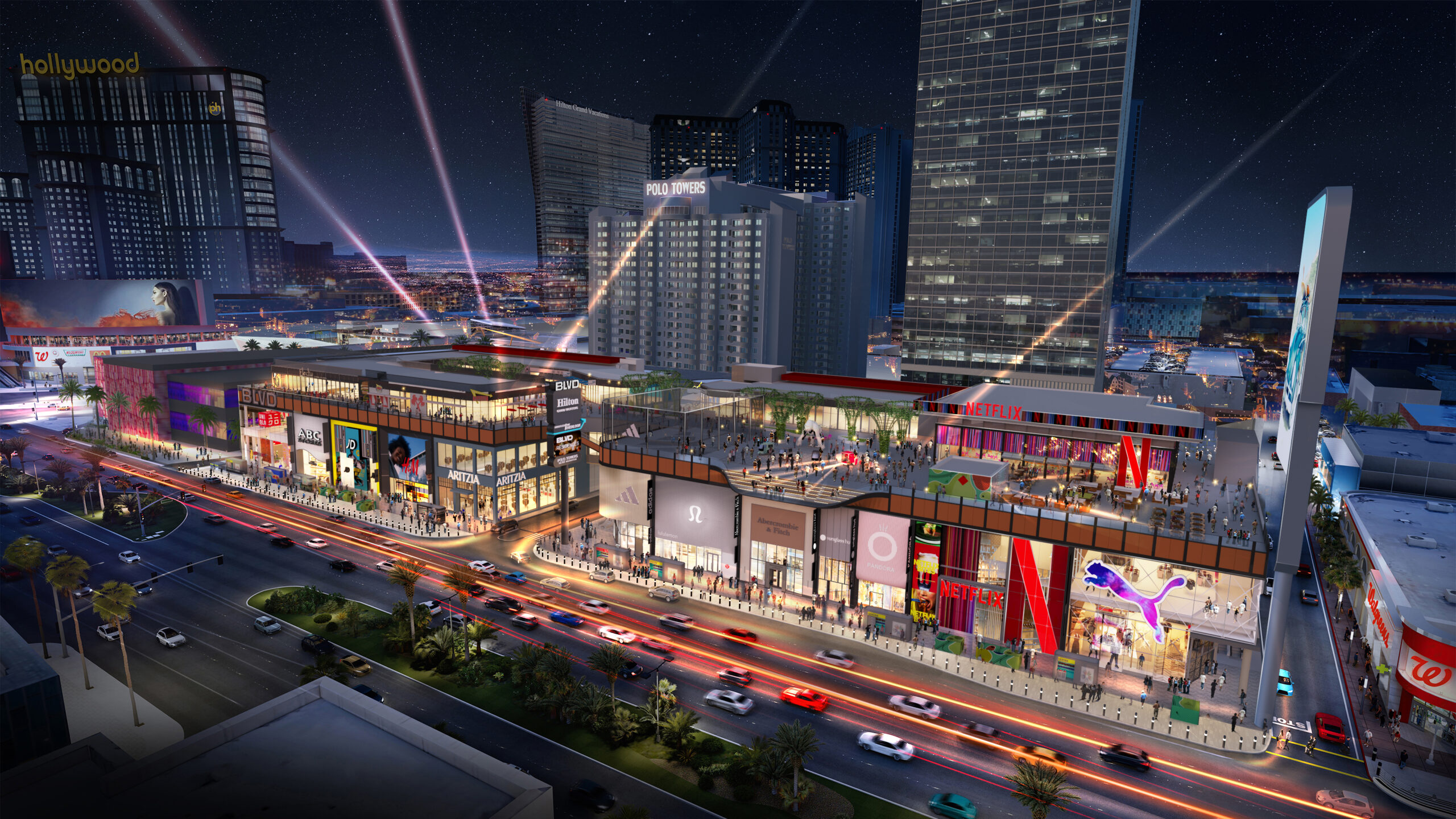 Aerial view of a vibrant shopping and entertainment complex on the Las Vegas Strip, featuring brands like Netflix, Puma, and Lululemon